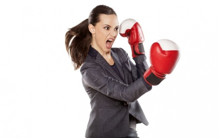 woman in leadership ready to fight wearing gloves